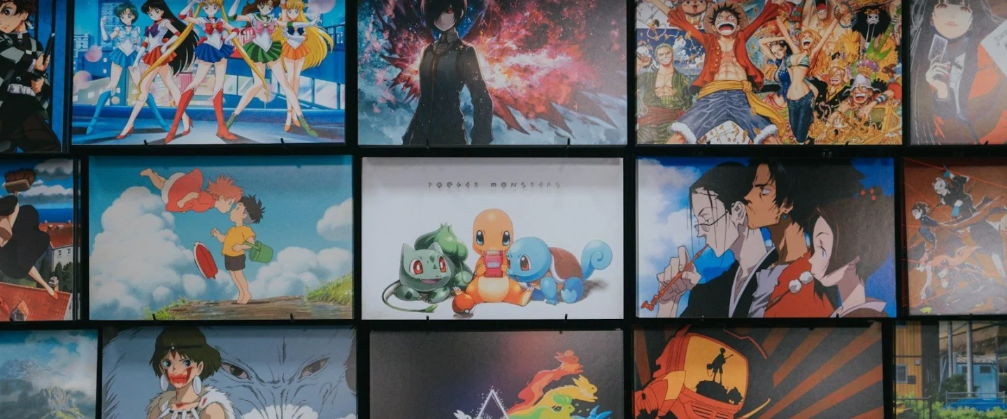 anime character collage photo on black wooden shelf