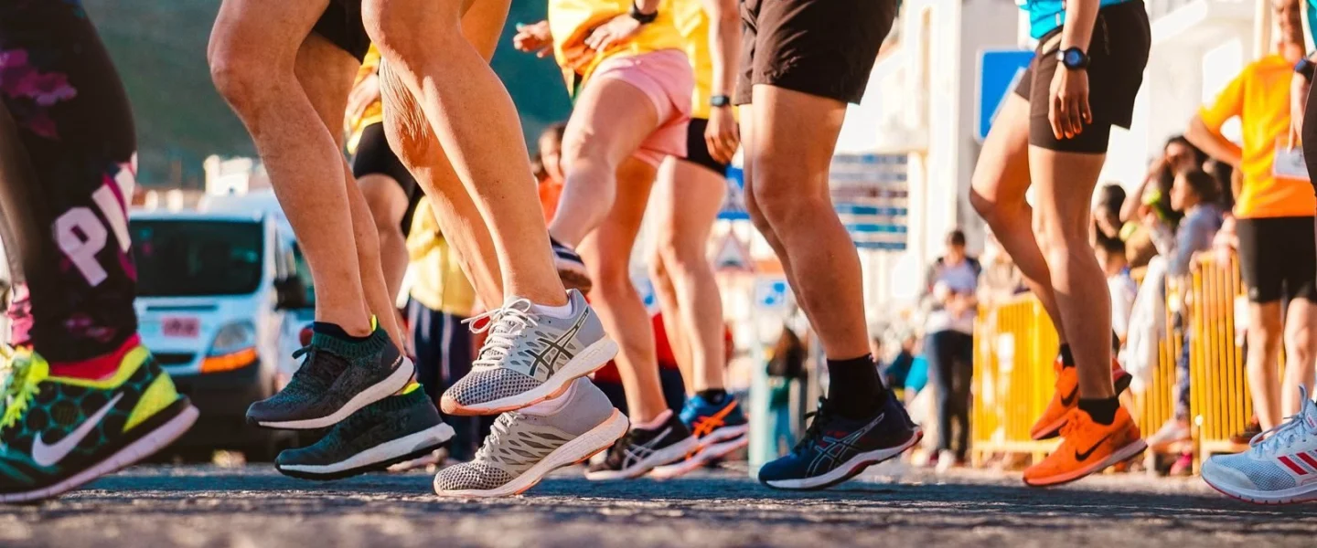 Group of runners participating in a city marathon during daylight.